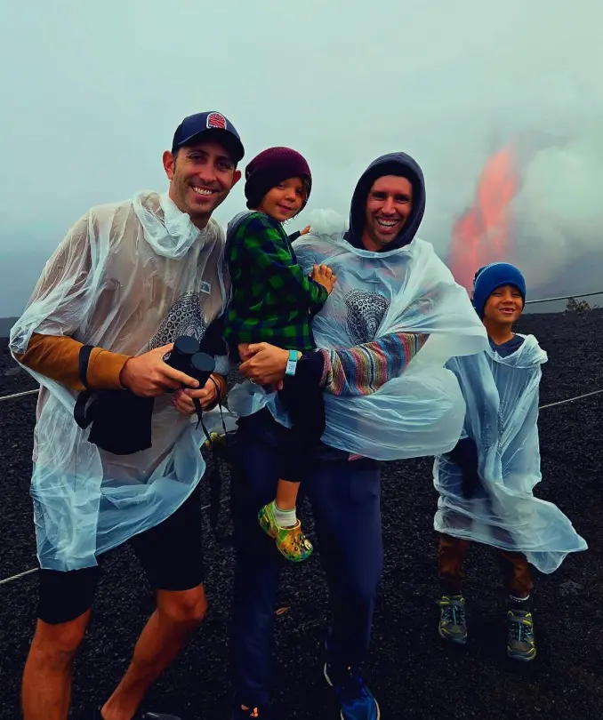 family in front of hawaii volcano