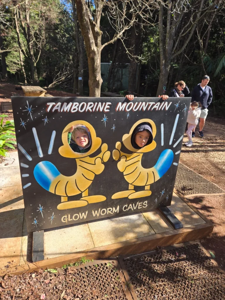 Tamborine Mountain Glow Worms and the Gold Coast — The Best Day Trip from Brisbane 2 glow worm sign with kids